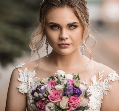 Portrait of a woman holding a bouquet of flowers